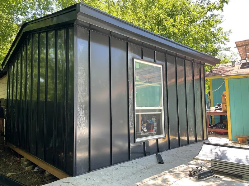 Black standing seam metal wall panels for Metal Roof Installation in DeWitt