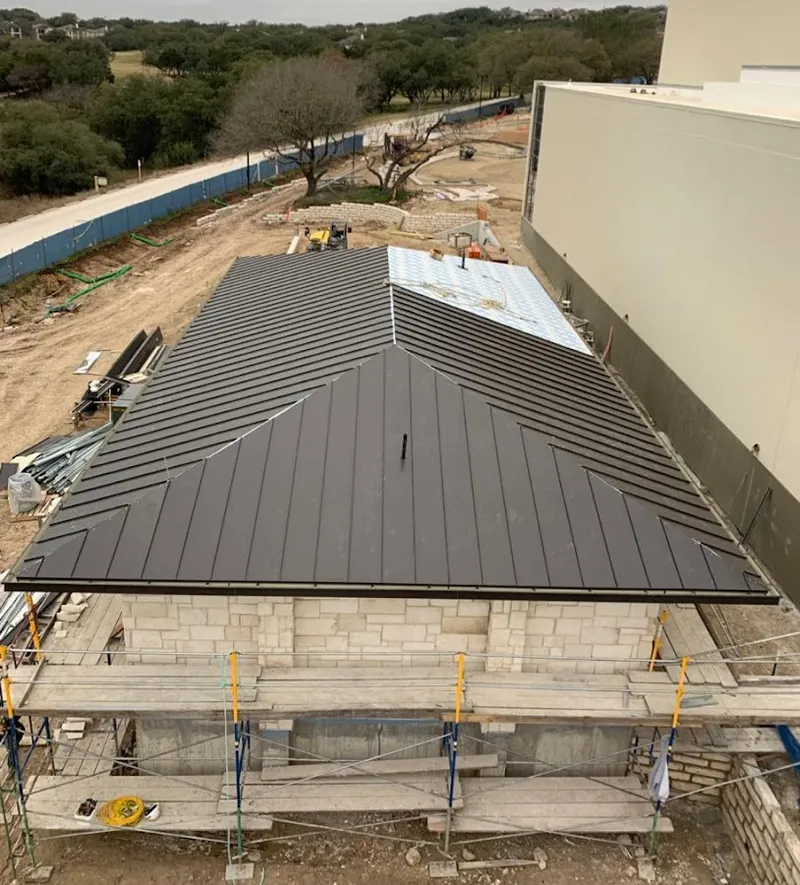 Metal roof new construction with scaffolding in DeWitt